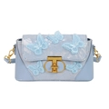 Light blue crossbody bag featuring 3D butterfly embroidery and golden T-lock hardware - Blue