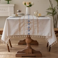Haverkleurig linnen tafelkleed met blauw borduursel en elegante beige kwastjesranden - 150x100cm / Blauw Diamantrooster
