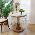 Translucent white lace tablecloth with colorful floral embroidery on a round wooden table - 145*100cm / Butterfly Small Leaves