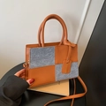 Retro patchwork handbag in brown leather and grey denim with adjustable shoulder strap - Brown