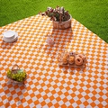 Classic orange and white checkered picnic mat on green grass for outdoor camping - Standard Size / Orange and White Plaid