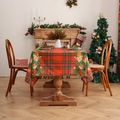 Red plaid Christmas tablecloth with festive prints and holiday patterns in a warm home setting - Plaid Christmas