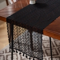 Detail of black hollow crochet table runner with wavy patterns and elegant fringe tassels - 35*91cm / Diamond Grid Black