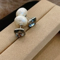 Macro detail of French style baroque pearl and gray faceted crystal stud earrings - E1118 Cotton Pearl Gray Zirconia / Gray / Cotton Pearl