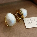 Detail of baroque pearl earrings with vintage gold base on a jewelry tray - Water Drop Pearl Style (E1080)