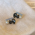 Unique seesaw earrings with black teardrop gems and white pearls on white knit fabric - Black Water Drop Pearl Style (E1542)