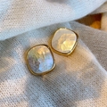 Macro shot of square gold earrings with white mother-of-pearl texture on knit fabric - Rounded Square 2.5*2.5cm / Gold