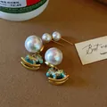 Luxury rocking horse pearl earrings and stud set with colorful blue enamel finish - Childhood Rocking Horse Set