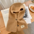 Close-up of thick camel knit hooded neck gaiter with dark decorative buttons - Dark Khaki