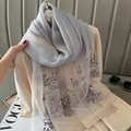 Detailed macro shot of floral embroidery on light gray silk blend scarf with mesh trim - Gray / 70*180cm