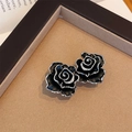 Vintage black camellia flower stud earrings with silver accents and micro-set crystals - Black Rose