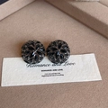 Detail of vintage flower stud earrings with black crystals on a warm textured surface - Black Hydrangea Style (E2267)