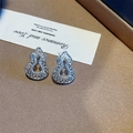 Detailed view of silver hulu stud earrings with hollow design and zircon accents - Silver Hollow Gourd