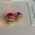 Macro shot of red heart pearl earrings with gold hollow lace and zircon inlay details - Red Pearl (Gold Hollow Heart)