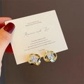Detailed close-up of gold square sugar glass stud earrings with elegant ribbon twist design - Ribbon Sugar Square