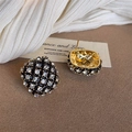 Vintage geometric shield stud earrings with gold plating and clear crystals on brown background - Gold Base White Zirconia