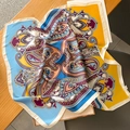 Close-up of vibrant paisley print silk scarf with luxury yellow and blue patterns - 70x70cm / Blue-Yellow