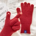 Red knit gloves with touchscreen fingertip openings and ribbed cuffs in waffle texture - One Size / Red