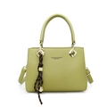 Pale green leather tote bag with lychee texture and decorative bell charm pendant - Green