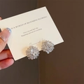 Elegant silver flower stud earrings with sparkling crystals held on a white card - Silver Daisy Style (E0461)