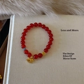Detail of red agate bead bracelet featuring golden horse charm and coin bead - Micro-set Rocking Horse Style (C475)