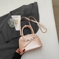 Elegant pearl pink shell handbag with adjustable strap on a dark blazer background - Pink (Without Pendant)
