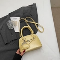 Cream yellow shell handbag with a heart charm and adjustable shoulder strap - Yellow (With Pendant)