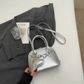 Silver metallic shell handbag with heart charm and adjustable strap for women - Silver (With Pendant)