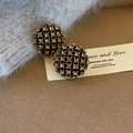 Close-up of hemisphere stud earrings with black grid pattern and champagne rhinestones - Silver Base Round Champagne Rhinestone (E2955)