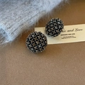 Vintage round rhinestone stud earrings with black mesh base shown on a velvet display - Silver Base Round Gray Rhinestone (E2956)