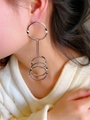 Detail of silver geometric multi-layer hoop earrings worn by a model in a modern style - Silver-Multi Layer Hoop
