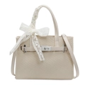 Cream white woven tote bag featuring a decorative lace bow and silver metal twist lock - White