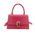 Magenta faux crocodile leather handbag with a metallic clasp and trapezoid structure - Rose Pink