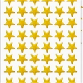 Macro detail of yellow laser five-point star stickers for kids rewards and DIY crafts - Yellow