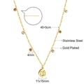 Detail of gold plated stainless steel necklace featuring a textured circular pendant - Gold Oval Leaf Style (NE29480MG)