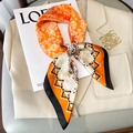 Elegant 70x70 orange floral silk scarf tied on a beige blazer with retro patterns - 70x70cm / Orange