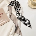 Detail of a black and white checkerboard twilly scarf tied on a white shirt collar - Checkerboard Pattern