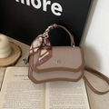Brown patchwork crossbody bag with woven texture and decorative silk scarf accessory - Khaki