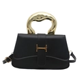 Structured black leather box bag with unique gold sculptural handle and buckle - Black