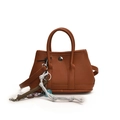 Brown lychee leather bucket bag with silver buckle and braided doll charm - With Pendant / Small / Brown