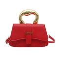 Red leather handbag with unique gold carved handle and H-shaped buckle closure - Red