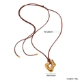 Minimalistische Pulloverkette aus Edelstahl mit hohlem goldenem Anhänger an brauner Kordel - Gold-Unregelmäßiger Hohlstil(NS000002G)