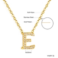 Macro shot of 18K gold plated letter E pendant with crystal inlay on stainless steel chain - Gold Letter E