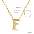 Macro detail of gold plated letter F pendant with crystals and dimensions on white background - Gold Letter F