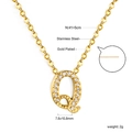 Macro detail of 18K gold plated letter Q pendant with dimensions 7.6x10.8mm and chain specs - Gold Letter Q