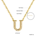 Macro detail of 18K gold plated stainless steel U-letter pendant with sparkling crystals - Gold Letter U