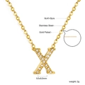Detailed view of pavé crystal X letter pendant on 18K gold plated stainless steel chain - Gold Letter X