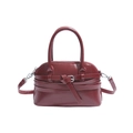 Deep red faux leather shell bag with decorative straps and dual top handles - Red