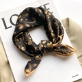 Elegant black and gold silk square scarf with paisley pattern on a beige coat - 53x53cm / Black