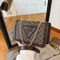 Brown monogram small square bag with chain strap and golden hardware in a mirror setting - Brown